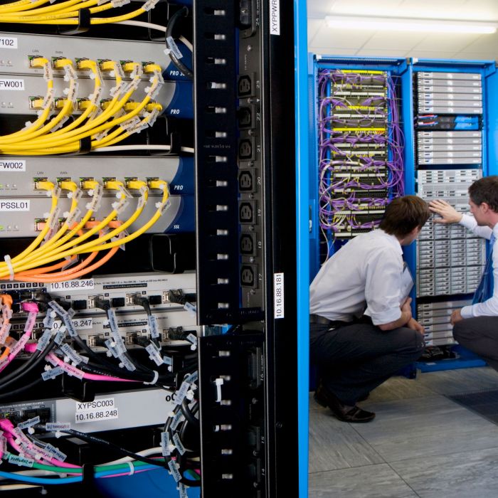 wide-shot-of-two-it-technicians-in-the-server-room-2026-01-11-08-38-02-utc