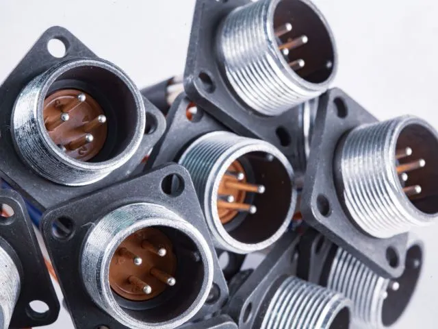 Close-up blurry metal sockets for plugs